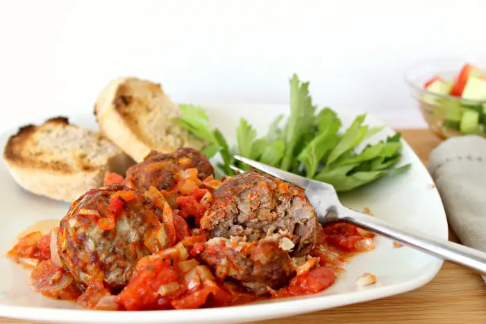 baked herby meatballs in tomato sauce