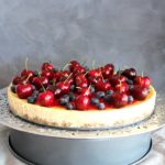 Baked Vanilla Cheesecake with Cherry Coulis. You won't believe how creamy & melt in your mouth this baked cheesecake is! It's super easy to make & absolutely perfect as a Christmas dessert | berrysweetlife.com