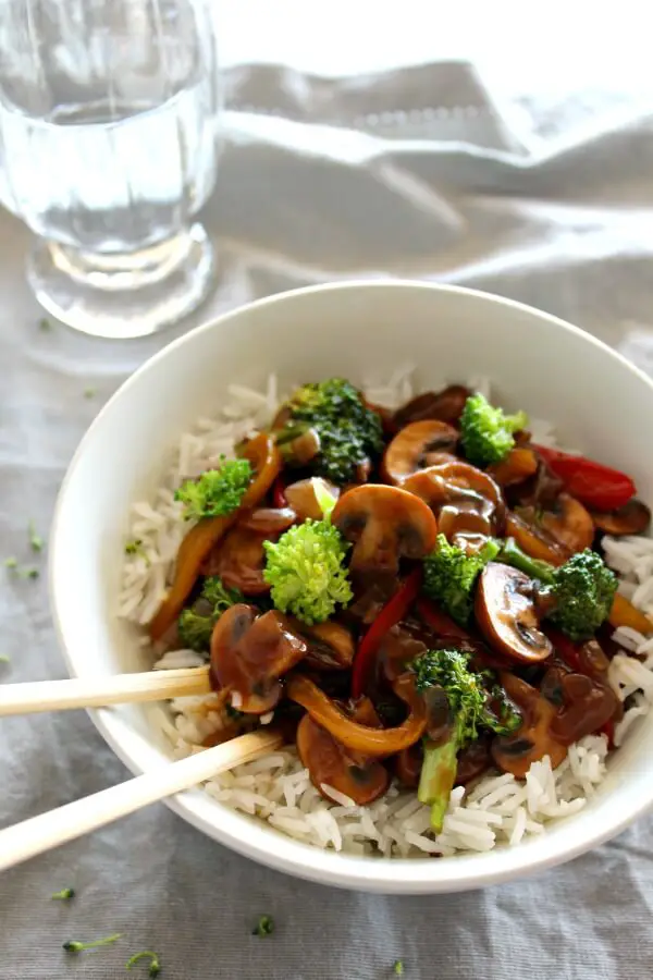 Mushroom Broccoli & Ginger Stir Fry. A delicious vegetarian dish for mushroom lovers. You won't believe the flavour punch that this dish packs! So healthy, quick & easy to make. Yum yum!! | berrysweetlife.com