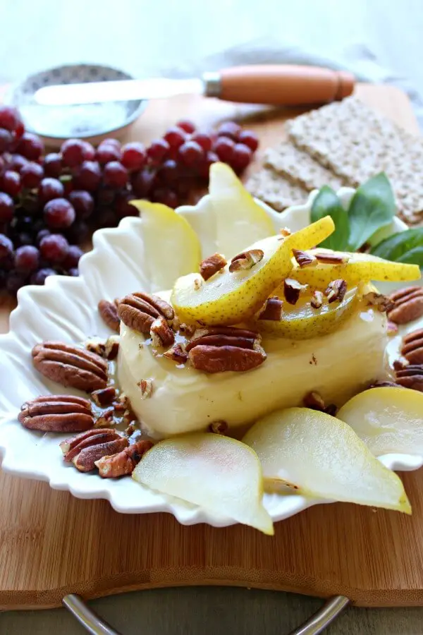 Cream Cheese Appetizer with Poached Pear & Toasted Pecans. A quick & easy recipe that looks and tastes incredible. Your friends & family will be so impressed! Perfect for any occasion | berrysweetlife.com