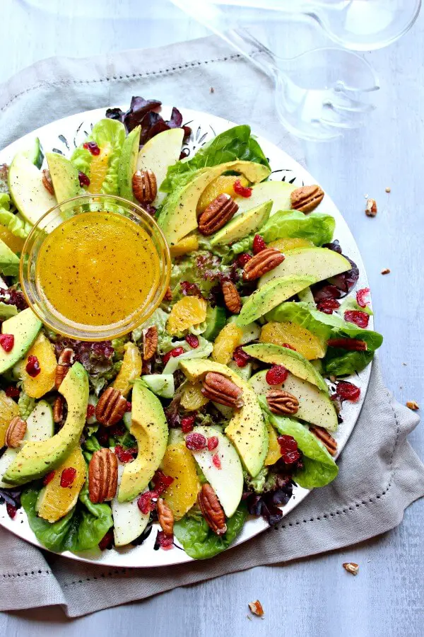 Pecan Cranberry & Avocado Salad with Orange Dressing. A colourful salad recipe perfect for Christmas or any special occasion. Healthy, quick & easy, the perfect side dish | berrysweetlife.com