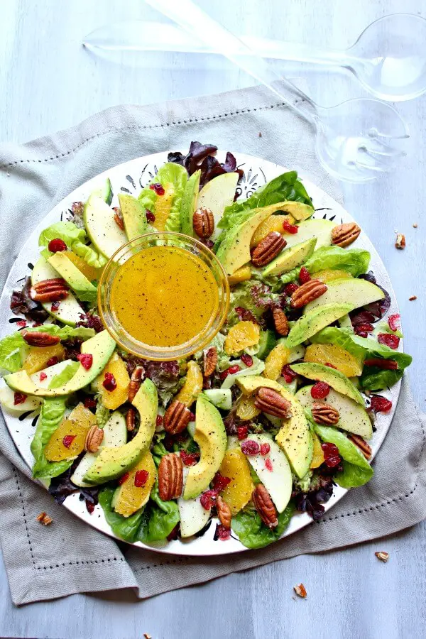 Pecan Cranberry & Avocado Salad with Orange Dressing. A colourful salad recipe perfect for Christmas or any special occasion. Healthy, quick & easy, the perfect side dish | berrysweetlife.com