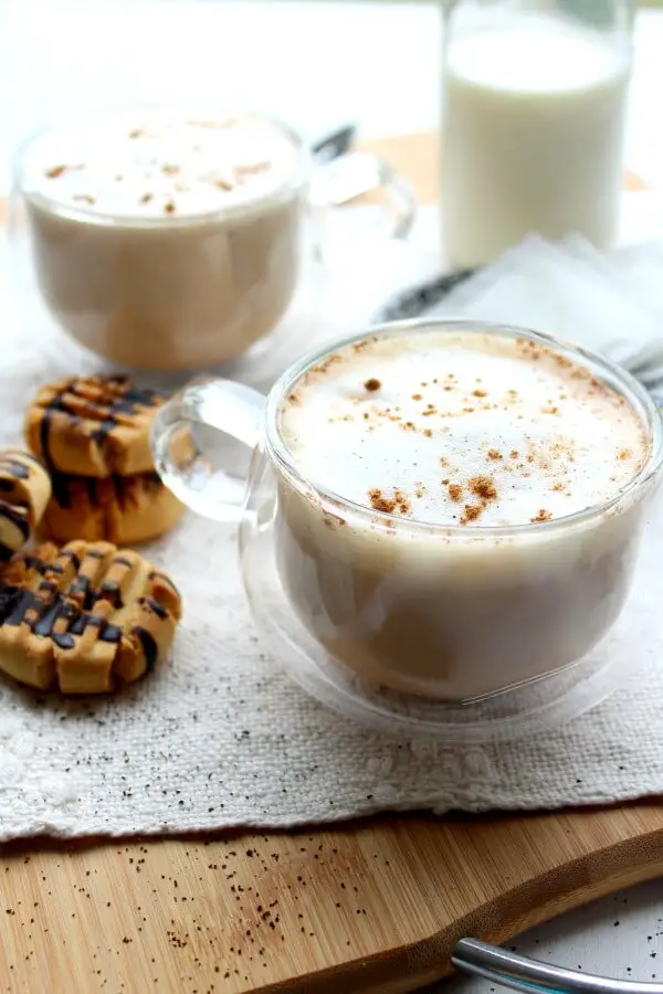 An easy to make hot Earl Grey tea latte with spices, vanilla and frothy milk. This Spiced Vanilla London Fog Latte is sugar free, healthy and so comforting! | berrysweetlife.com