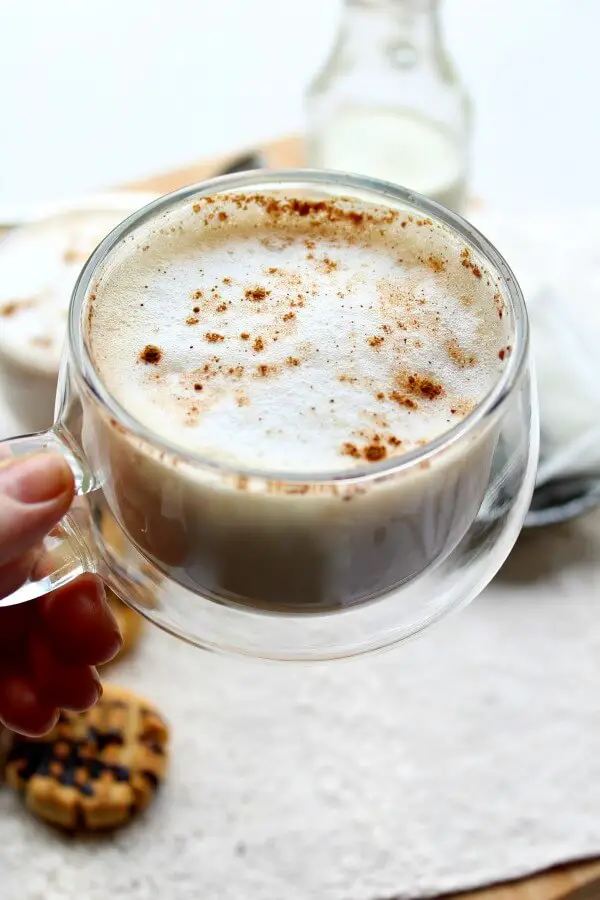 An easy to make hot Earl Grey tea latte with spices, vanilla and frothy milk. This Spiced Vanilla London Fog Latte is sugar free, healthy and so comforting! | berrysweetlife.com