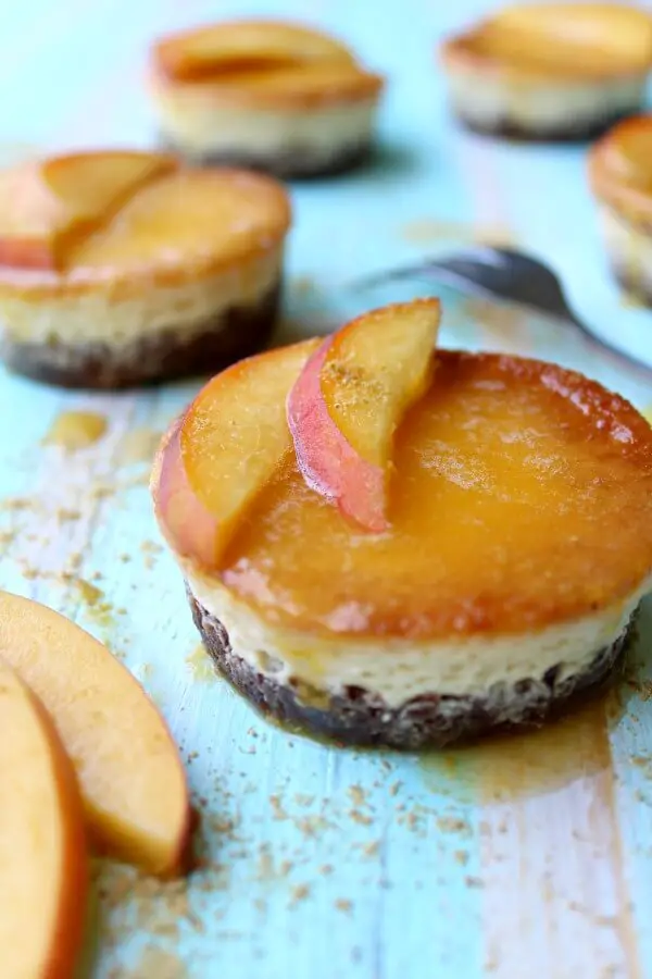 Mini Lemon & Ginger Cheesecake with Peach Coulis. Easy dessert recipe. Delicious creamy melt in the mouth baked fruit cheesecakes. Makes 16. You will love this recipe! | berrysweetlife.com