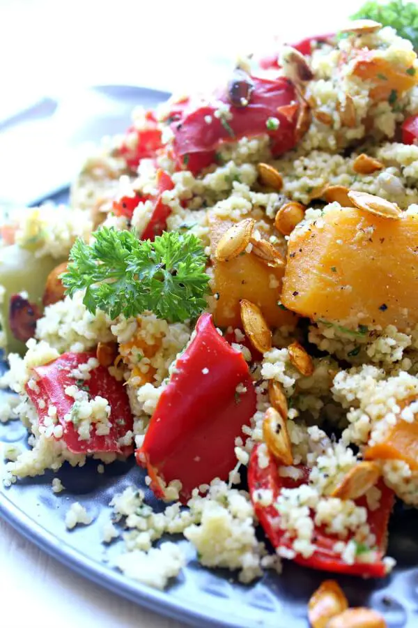 Roasted Butternut Squash Cous Cous Salad with Pesto Dressing. An easy, healthy vegetarian salad that is bursting with colour and flavour. You can't go wrong with this healthy dish! | berrysweetlife.com