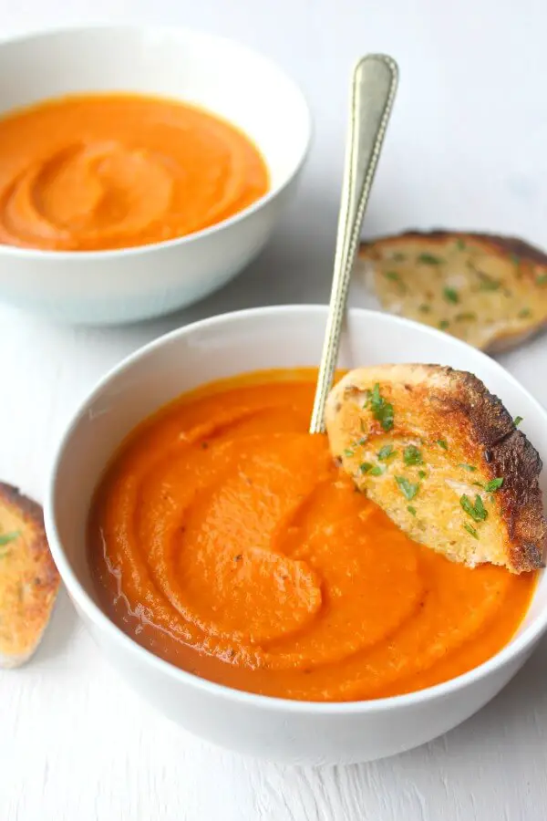 Cozy Up Tomato & Butternut Squash Soup. The perfect soup for a cozy night in! It's a quick & easy recipe packed with flavour that everyone will enjoy | berrysweetlife.com