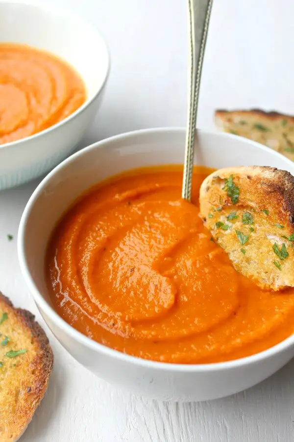 Cozy Up Tomato & Butternut Squash Soup. The perfect soup for a cozy night in! It's a quick & easy recipe packed with flavour that everyone will enjoy | berrysweetlife.com