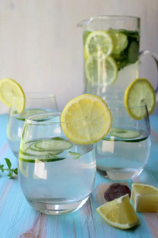Lemon Basil Cucumber Infused Water. A refreshing summer drink perfect for a hot day by the pool! Such a healthy way to quench your thirst | berrysweetlife.com