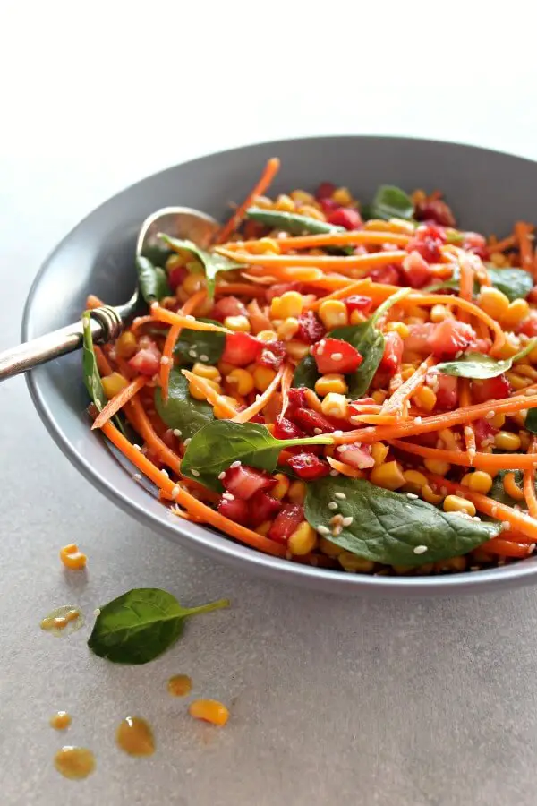 Asian Carrot Salad with Peanut Ginger Dressing. A crunchy, flavourful salad with a smooth, peanut dressing. The perfect light, healthy meal or delicious side dish for any occasion | berrysweetlife.com