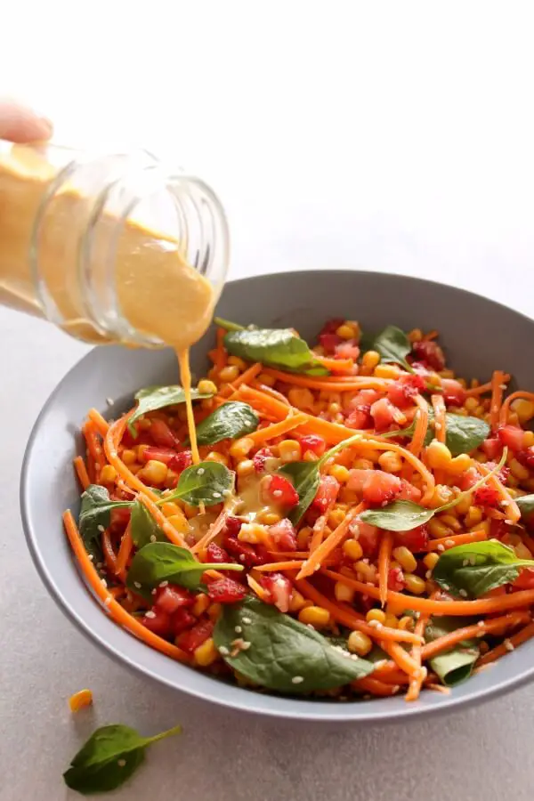 Asian Carrot Salad with Peanut Ginger Dressing. A crunchy, flavourful salad with a smooth, peanut dressing. The perfect light, healthy meal or delicious side dish for any occasion | berrysweetlife.com