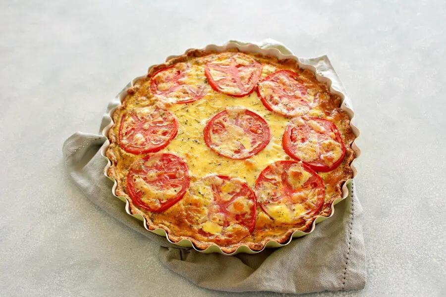 Easy Cheese Crust Tomato Quiche. A no roll, press down cheese and herb crust with a layered tomato and cheese egg filling. Simply YUM! | berrysweetlife.com