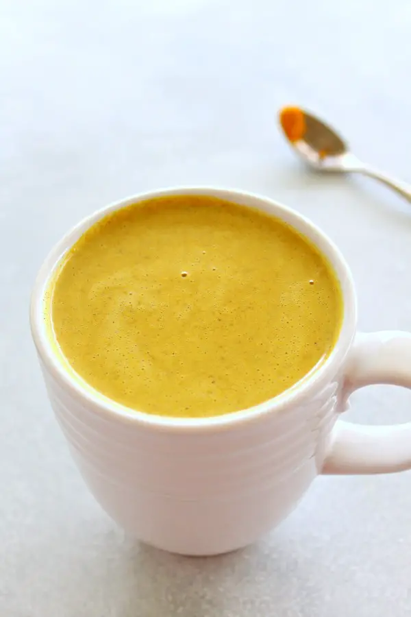 An ancient immune-boosting remedy - Golden Milk Turmeric Ginger Latte is loaded with vitamins, minerals, antioxidants and anti-inflammatory properties. It's slightly sweet, spicy, thick and comforting! | berrysweetlife.com