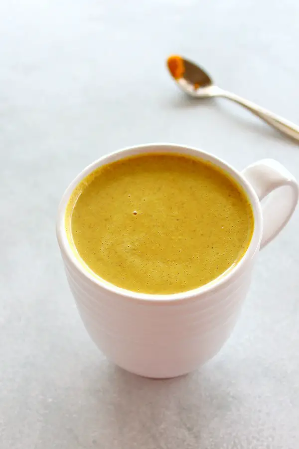 An ancient immune-boosting remedy - Golden Milk Turmeric Ginger Latte is loaded with vitamins, minerals, antioxidants and anti-inflammatory properties. It's slightly sweet, spicy, thick and comforting! | berrysweetlife.com