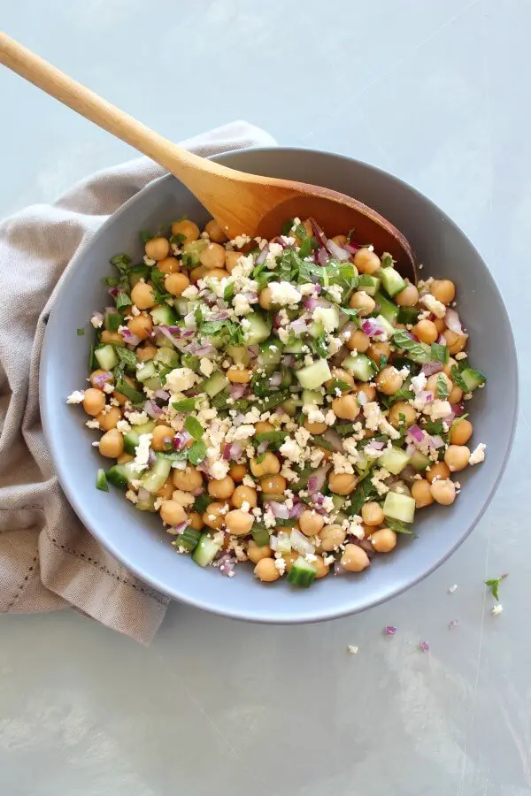 A heavenly combination! This easy Clean Eating Cucumber Mint Chickpea Salad salad is made with cucumber, mint, chickpeas, red onion, feta and almonds | berrysweetlife.com