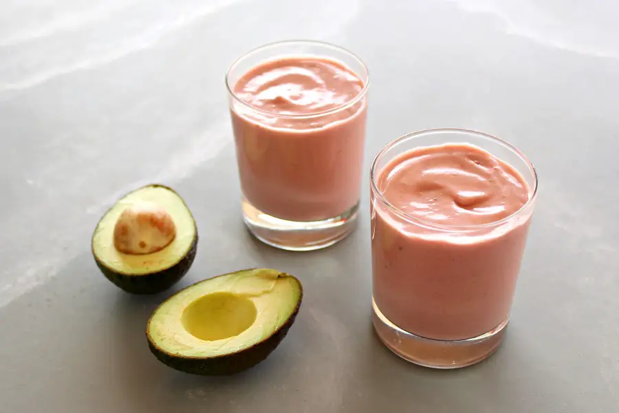 Incredible Strawberry Avocado Smoothie. A 5 minute, 5 ingredient nutrient rich smoothie that is SO CREAMY, fruity, sweet and delicious! | berrysweetlife.com