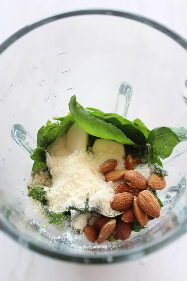 Make easy basil pesto with this Simple Homemade Fresh Basil Pesto recipe, it's beautifully fresh. Made with basil, almonds, olive oil, garlic and parmesan | berrysweetlife.com