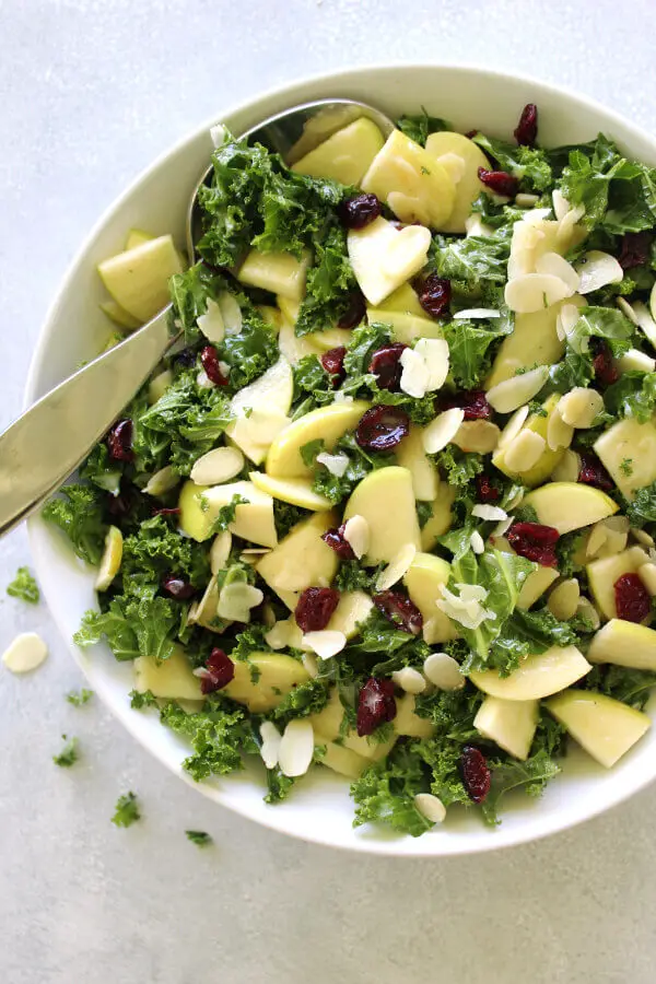 Super healthy, crunchy and tasty Kale Apple Cranberry Salad With Sesame Dressing is quick and easy to make, the ideal side dish for any occasion | berrysweetlife.com