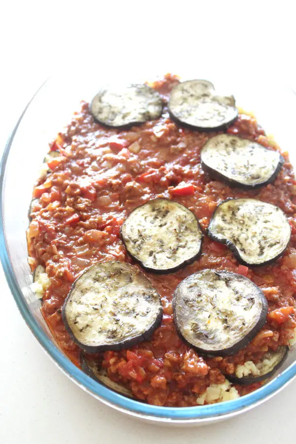 A delicious layered eggplant and mince bake topped with cheese. This is called a Cheats Healthy Beef & Brinjal Moussaka because it’s SO easy to make! | berrysweetlife.com