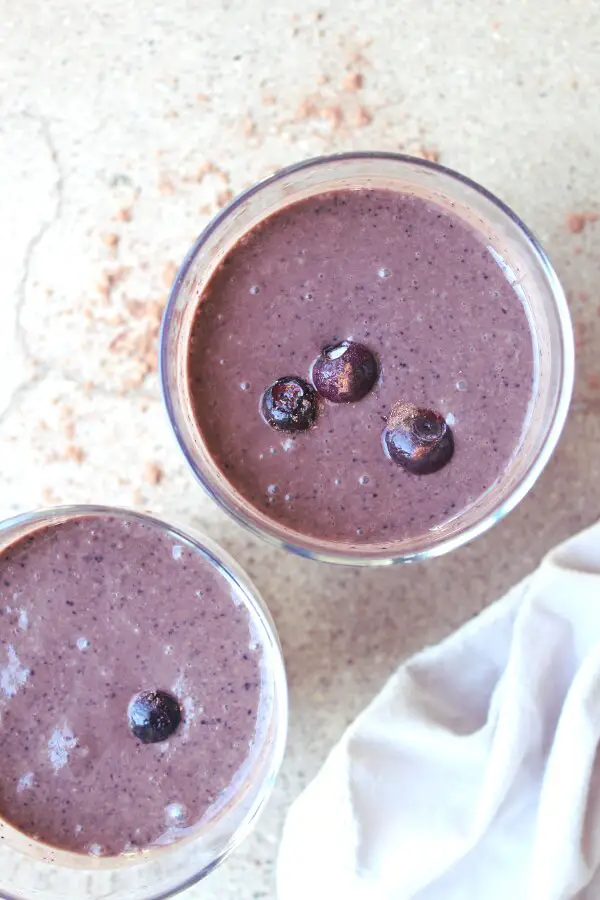 The most satisfyingly delicious, thick and creamy smoothie full of healthy goodness - This Cacao Blueberry Dessert Smoothie is heaven-sent | berrysweetlife.com