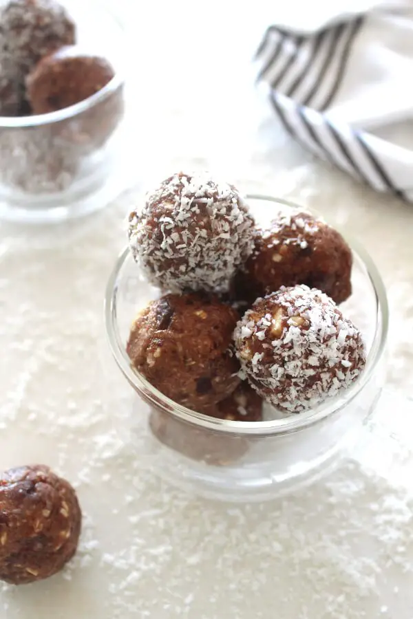 Melt in your mouth smooth, creamy, nutty, sweet and chocolatey! Cacao Coconut Date Bliss Balls are like dessert, yet are a healthy and easy to make snack! | berrysweetlife.com